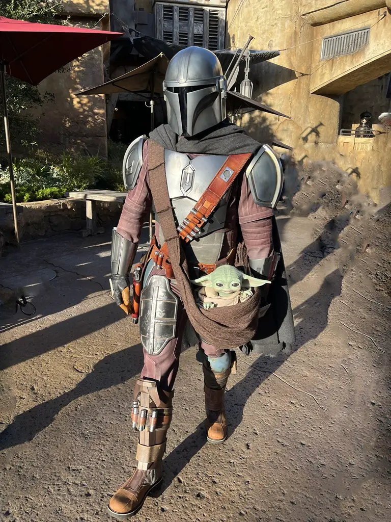 The Mandalorian with Grogu at Black Spire Marketplace