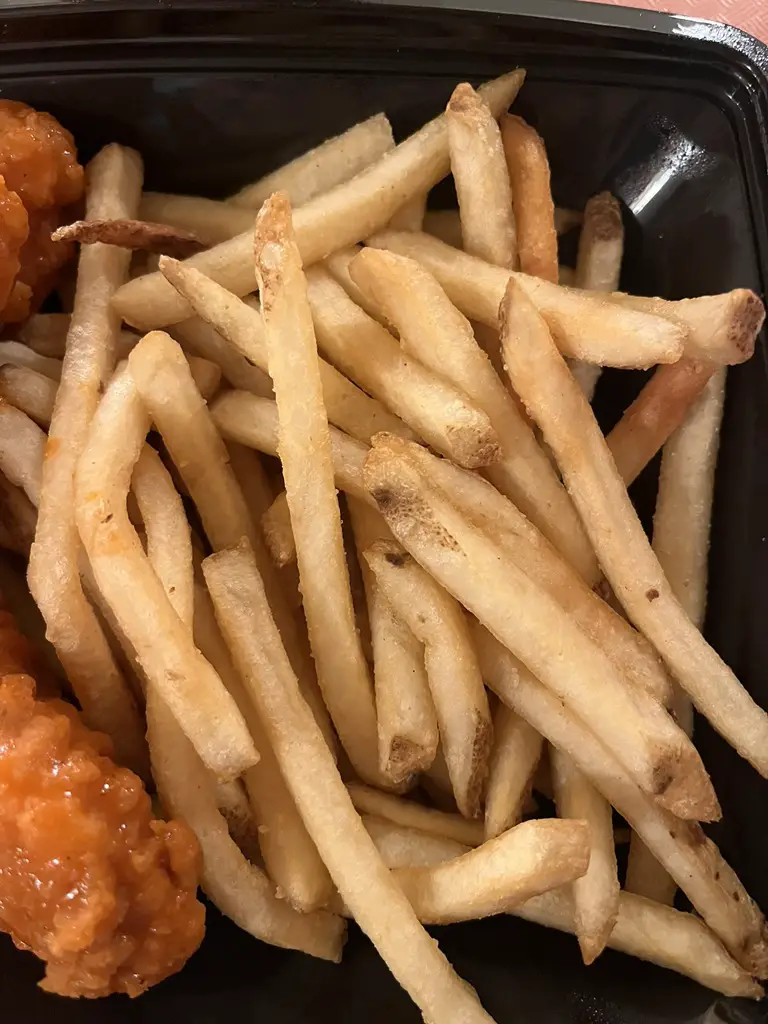 Buffalo Sauce Chicken Tenders at The Golden Horseshoe with French Fries